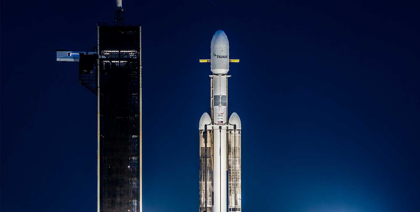 ViaSat-3 satellite on the launchpad at night